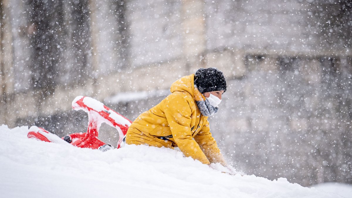 A child enjoys a snowy day as a powerful winter storm blankets Erzurum, Türkiye, Nov. 25, 2024. (AA Photo)