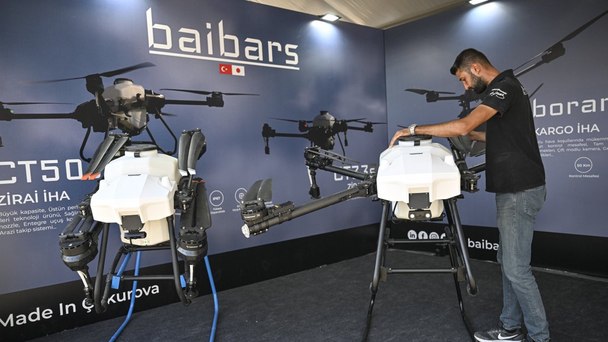 A person is photographed next to the UAVs produced by Baibars Mechatronics Aviation, Türkiye, Nov. 24, 2024. (AA Photo)