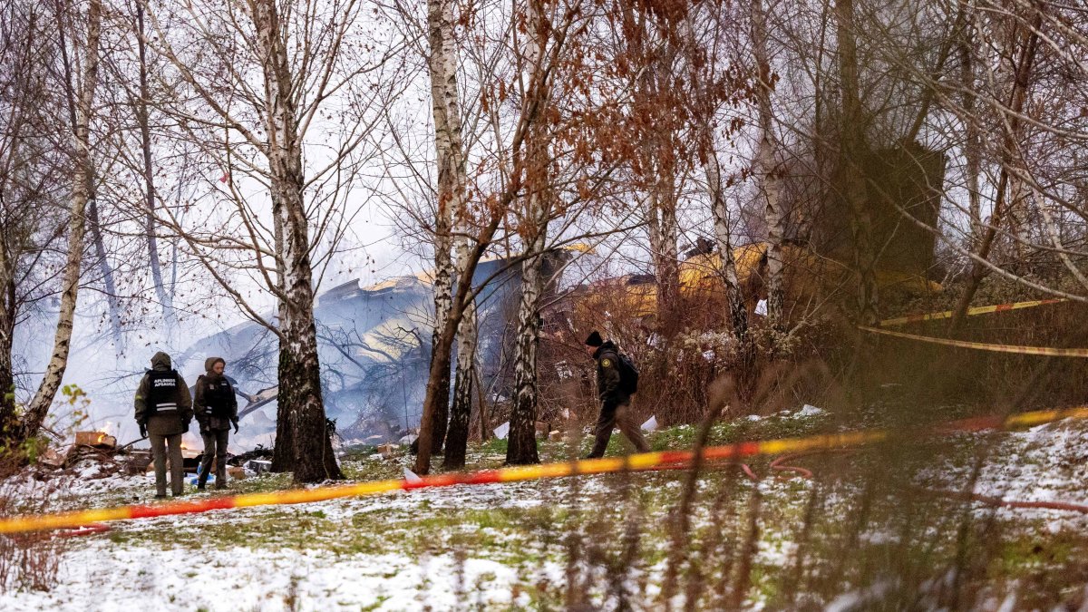 Rescuers work near the wreckage of the DHL cargo plane at the crash site near Vilnius International Airport, Lithuania, Nov. 25, 2024. (Reuters Photo)