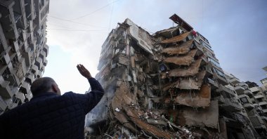 A man gestures near a building destroyed by Israeli airstrikes on Beirut&#039;s southern suburbs, Lebanon, Nov. 25, 2024. (Reuters Photo)