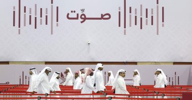 Qatari men line up at a polling station in Doha to cast their votes in a general referendum on constitutional amendments, including scrapping legislative council elections, Doha, Qatar, Nov. 5, 2024. (AFP Photo)