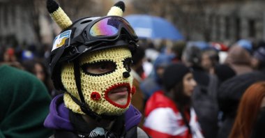 Supporters of Georgian opposition parties block the Georgian parliament building to protest against the results of the parliamentary election, before the first session of the newly elected government in Tbilisi, Georgia, Nov. 25, 2024. (EPA Photo)