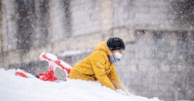 A child enjoys a snowy day as a powerful winter storm blankets Erzurum, Türkiye, Nov. 25, 2024. (AA Photo)