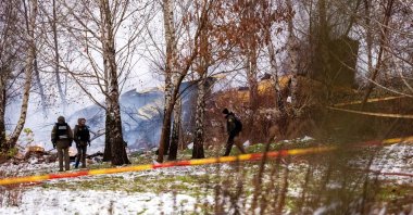 Rescuers work near the wreckage of the DHL cargo plane at the crash site near Vilnius International Airport, Lithuania, Nov. 25, 2024. (Reuters Photo)
