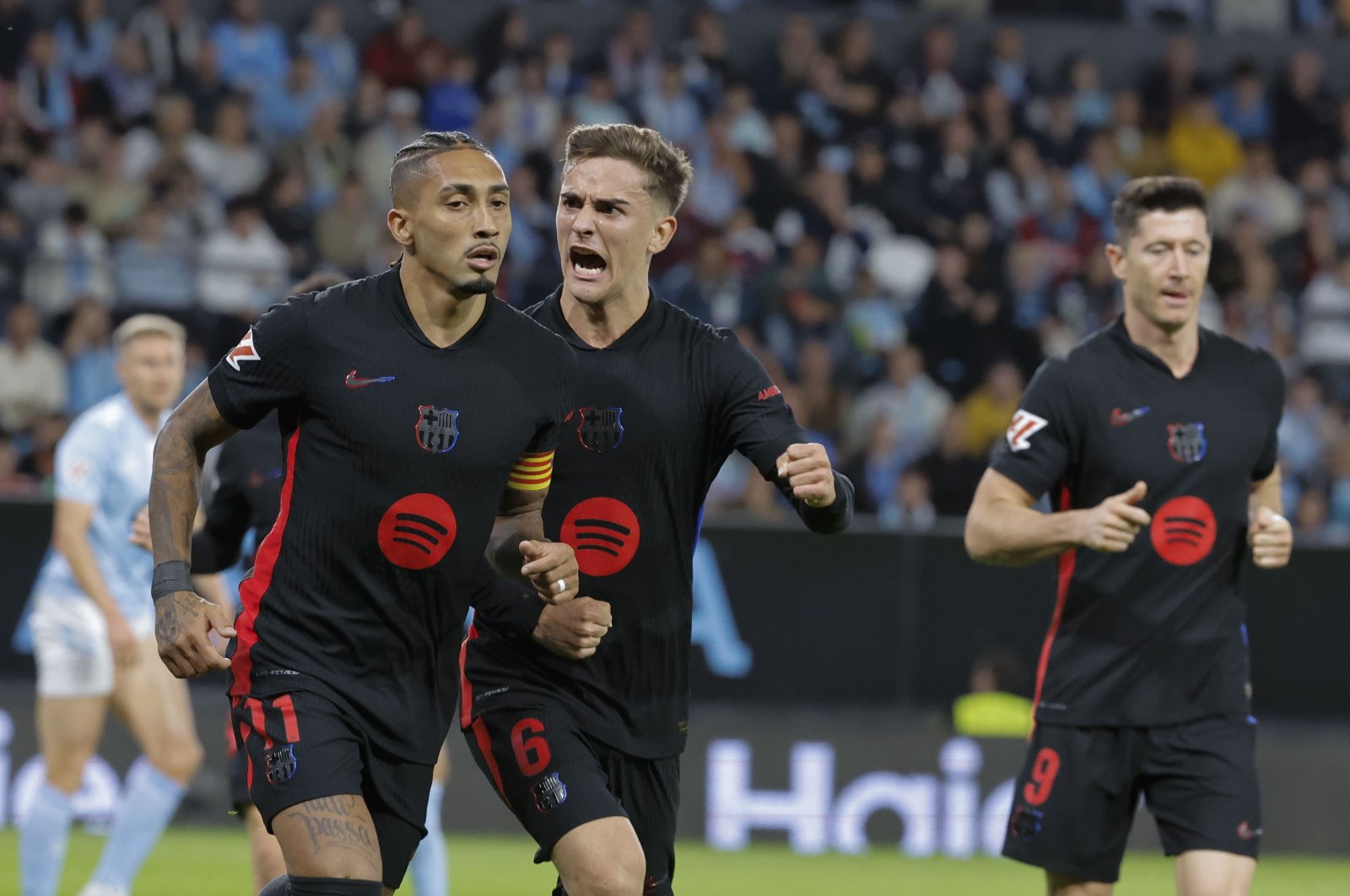 Barcelona&#039;s Raphinha (L) celebrates with teammates after scoring during the La Liga match against Celta Vigo at Balaidos stadium, Vigo, Galicia, Spain, Nov. 23, 2024. (EPA Photo)