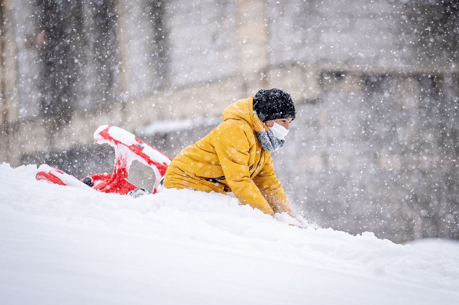 A child enjoys a snowy day as a powerful winter storm blankets Erzurum, Türkiye, Nov. 25, 2024. (AA Photo)