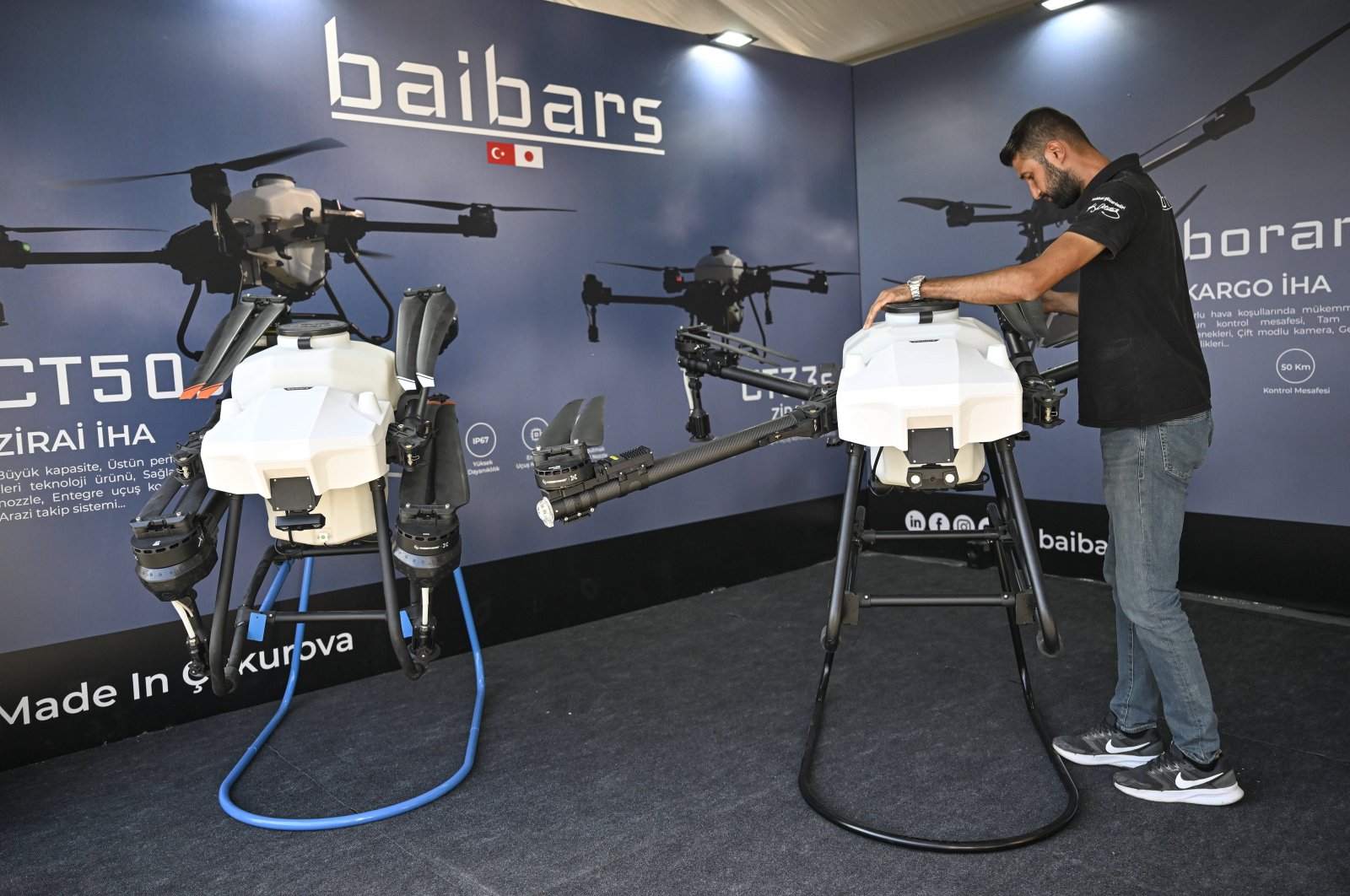 A person is photographed next to the UAVs produced by Baibars Mechatronics Aviation, Türkiye, Nov. 24, 2024. (AA Photo)