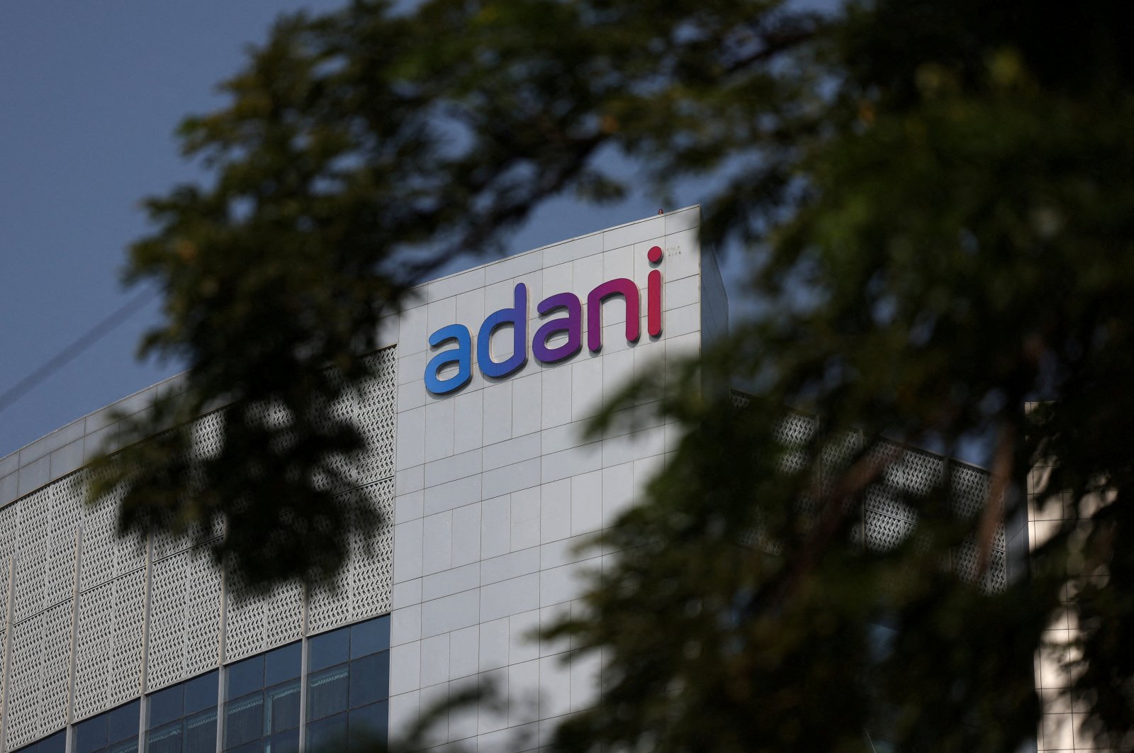 The logo of the Adani Group is seen on the facade of its Corporate House on the outskirts of Ahmedabad, India, Nov. 21, 2024. (Reuters Photo)