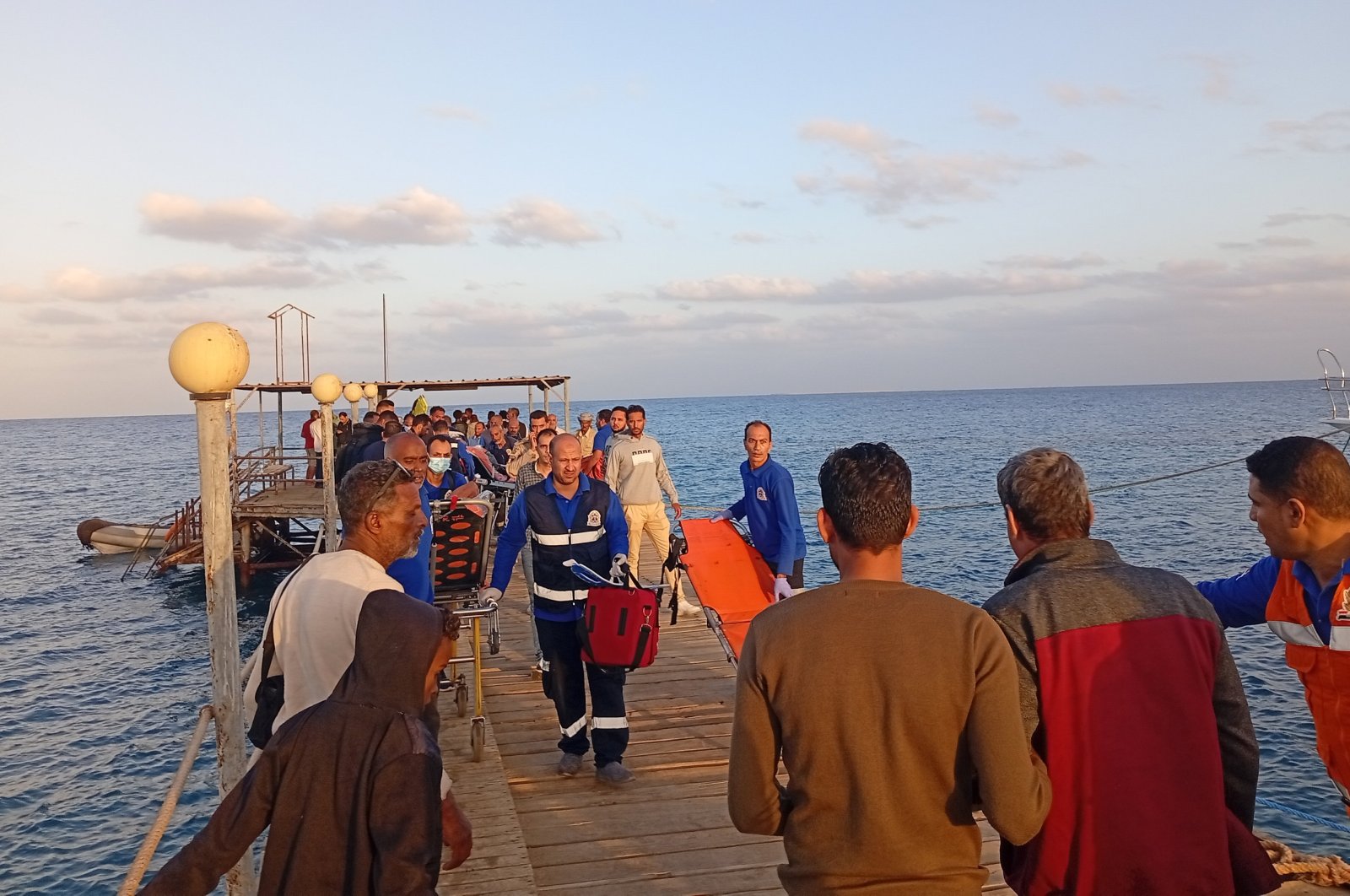 Medics and people wait for possible survivors after a boat sank at a harbor in Marsa Alam, Red Sea Governorate, in Egypt, Nov. 2024. (EPA Photo)