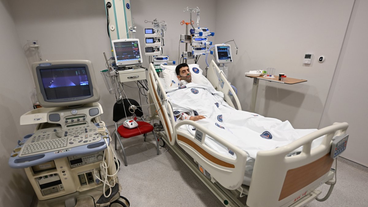 Recipient Mehmet Yıldırım, 32, lies on a hospital bed after undergoing heart transplant surgery in Antalya, southern Türkiye, Nov. 25, 2024. (AA Photo)