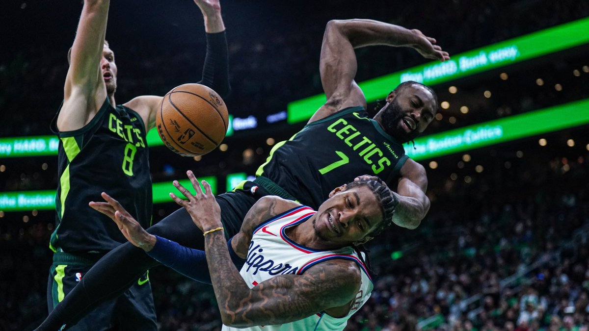 Boston Celtics guard Jaylen Brown (R) fouls LA Clippers guard Kevin Porter Jr. (C) in the second half at TD Garden, Boston, Massachusetts, U.S., Nov. 25, 2024. (Reuters Photo)
