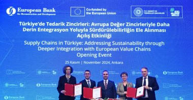 Industry and Technology Minister Mehmet Fatih Kacır (C) and EBRD President Odile Renaud-Basso (2-R) along with other officials attend the signing ceremony for the new decarbonization investment platform at the event in Ankara, Türkiye, Nov. 25, 2024. (AA Photo)