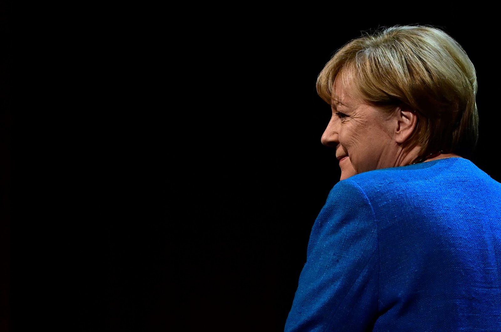 Former German chancellor Angela Merkel arrives on stage for her first public interview since stepping down, at the Berliner Ensemble Theatre, Berlin, Germany, June 7, 2022. (AFP File Photo)