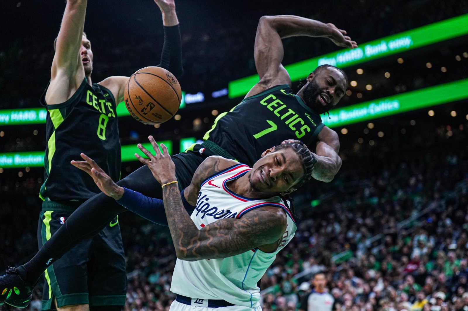 Boston Celtics guard Jaylen Brown (R) fouls LA Clippers guard Kevin Porter Jr. (C) in the second half at TD Garden, Boston, Massachusetts, U.S., Nov. 25, 2024. (Reuters Photo)