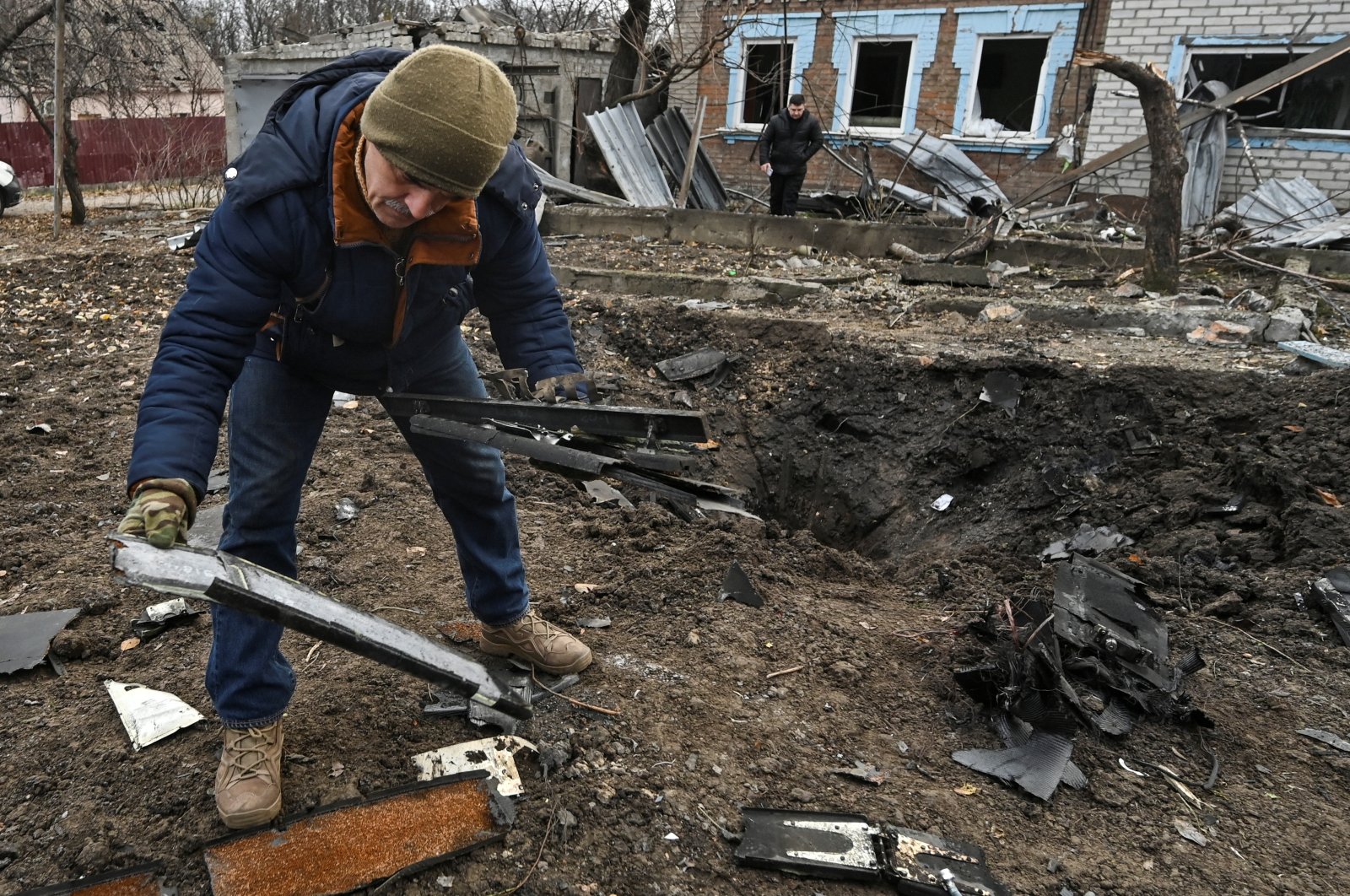 A man inspects parts of a kamikaze drone at a site of a residential area damaged by a Russian drone strike, in Zaporizhzhia, Ukraine, Nov. 25, 2024. (Reuters Photo)