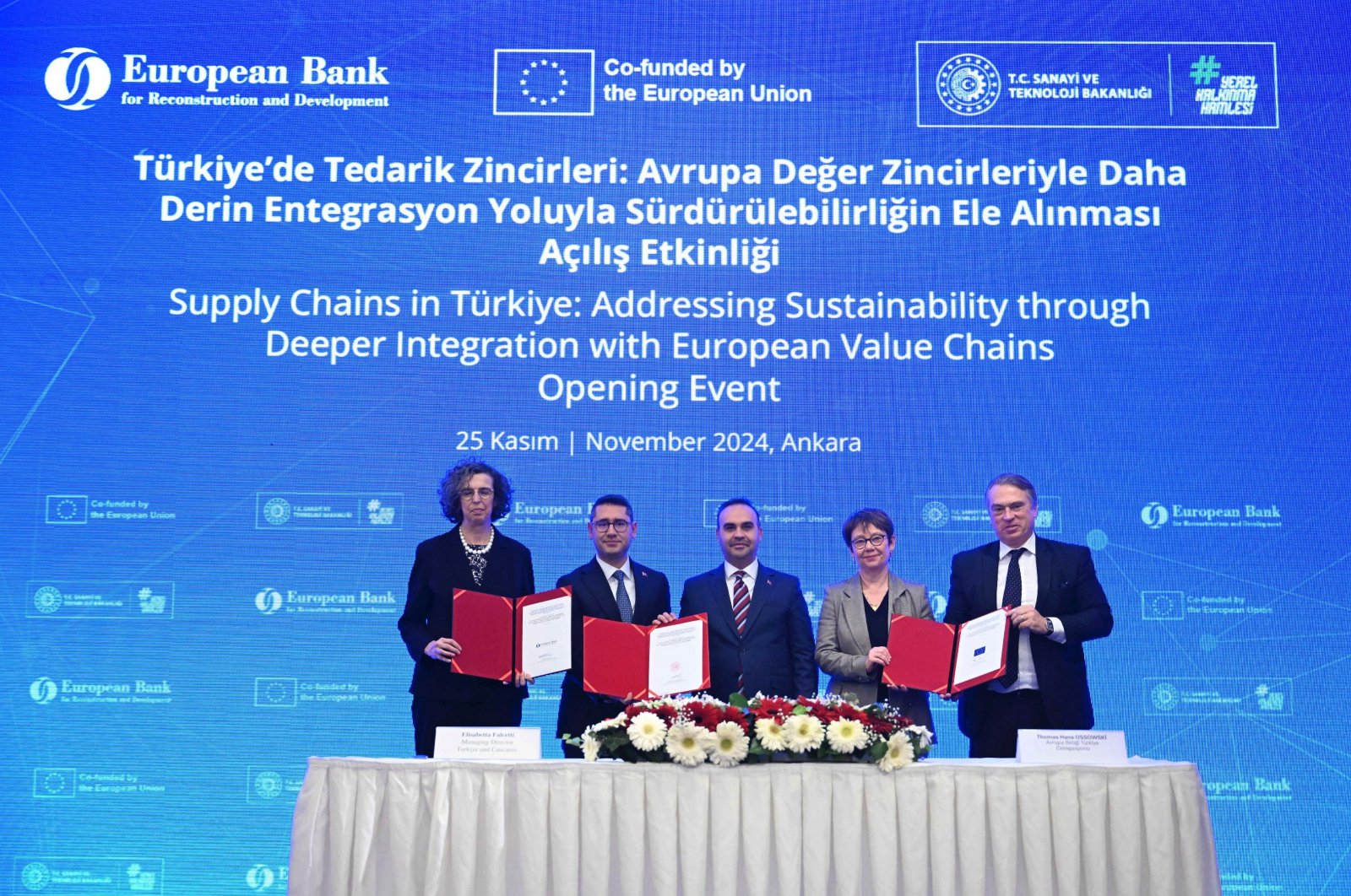 Industry and Technology Minister Mehmet Fatih Kacır (C) and EBRD President Odile Renaud-Basso (2-R) along with other officials attend the signing ceremony for the new decarbonization investment platform at the event in Ankara, Türkiye, Nov. 25, 2024. (AA Photo)