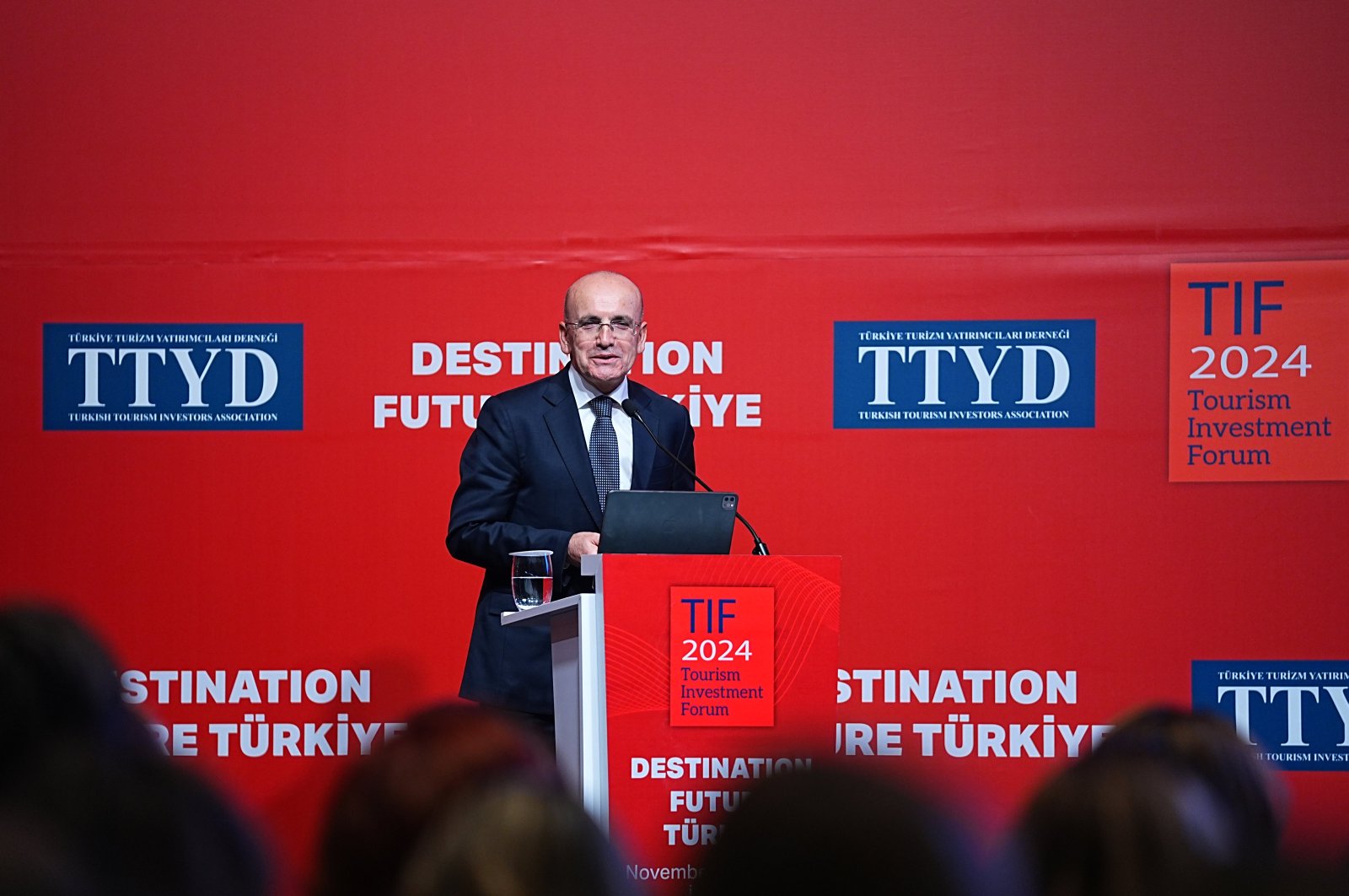 Treasury and Finance Minister Mehmet Şimşek speaks during the Tourism Investment Forum in Istanbul, Türkiye, Nov. 26, 2024. (AA Photo)