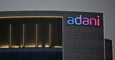 The logo of the Adani Group is seen on the facade of one of its buildings on the outskirts of Ahmedabad, India, April 13, 2021. (Reuters Photo)