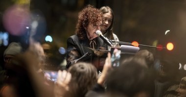 Nan Goldin speaks at the opening of her exhibition &quot;Nan Goldin. This Will Not End Well&quot; at the New National Gallery, Berlin, Germany, Nov. 22. 2024. (AP Photo)