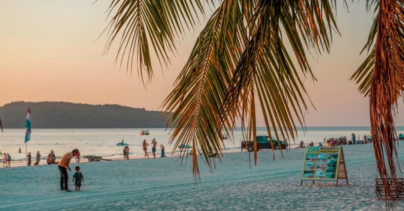People walk along the Chenang beach in Langkawi island, Malaysia, Jan. 29, 2024. (Shutterstock Photo)