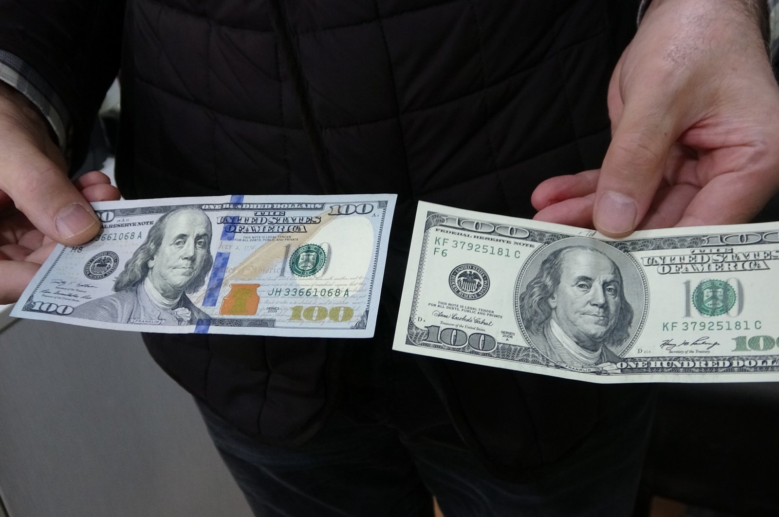 A man holds $100 bills in Bursa, northwestern Türkiye, Nov. 27, 2024. (IHA Photo)