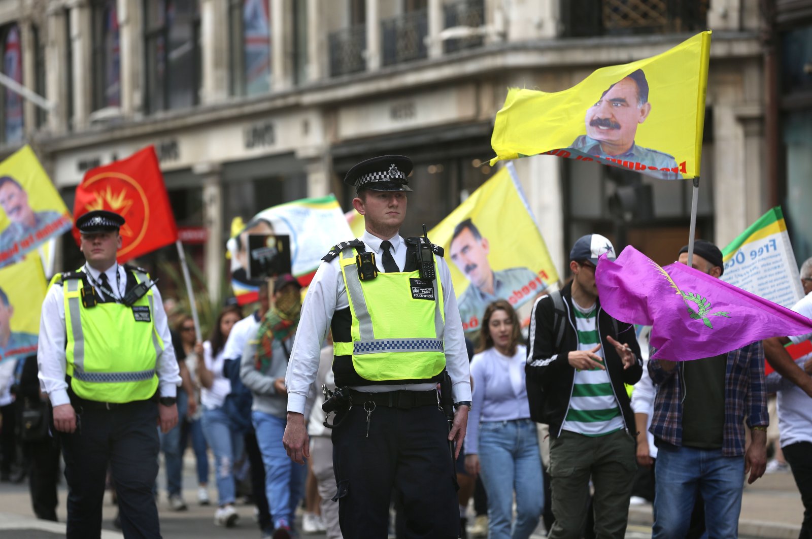 Police officers keep an eye on PKK supporters in case they fly the illegal PKK flag as they march through central London, U.K., June 11, 2022. (Getty Images Photo)