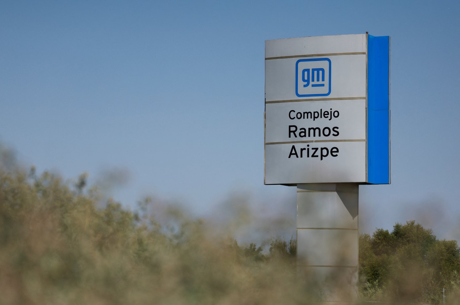 A view of the GM logo on a sign board at the Ramos Arizpe plant of General Motors, which exports vehicles to the U.S. and Canada, Ramos Arizpe, Coahuila state, Mexico, Nov. 2, 2024. (Reuters Photo)