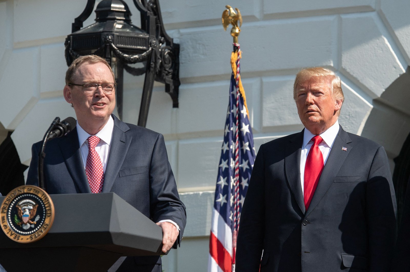 Kevin Hassett, Chair of the Council of Economic Advisers, speaks about the economy as then-U.S. President Donald Trump (C) looks on at the White House in Washington, D.C., July 27, 2018. (AFP File Photo)