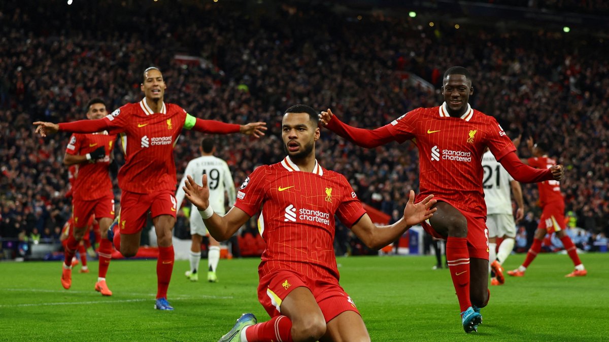 Liverpool&#039;s Cody Gakpo (C), Virgil van Dijk (L) and Ibrahima Konate celebrate after a Champions League goal against Real Madrid at Anfield, Liverpool, U.K., Nov. 27, 2024. (Reuters Photo)