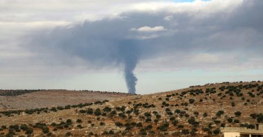 Smoke rises during clashes between members of Hayat Tahrir al-Sham and Assad regime forces, near Atarib, Syria, Nov. 27, 2024. (AFP Photo)
