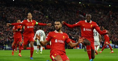 Liverpool's Cody Gakpo (C), Virgil van Dijk (L) and Ibrahima Konate celebrate after a Champions League goal against Real Madrid at Anfield, Liverpool, U.K., Nov. 27, 2024. (Reuters Photo)