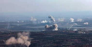 In this picture taken from the northern Syrian village of Ariha, smoke billows from the site of clashes and mutual shelling between Syrian anti-regime fighters and allied factions and regime forces on the front lines on the outskirts of the city of Saraqib in Syria&#039;s Aleppo province, Nov. 28, 2024. (AFP Photo)