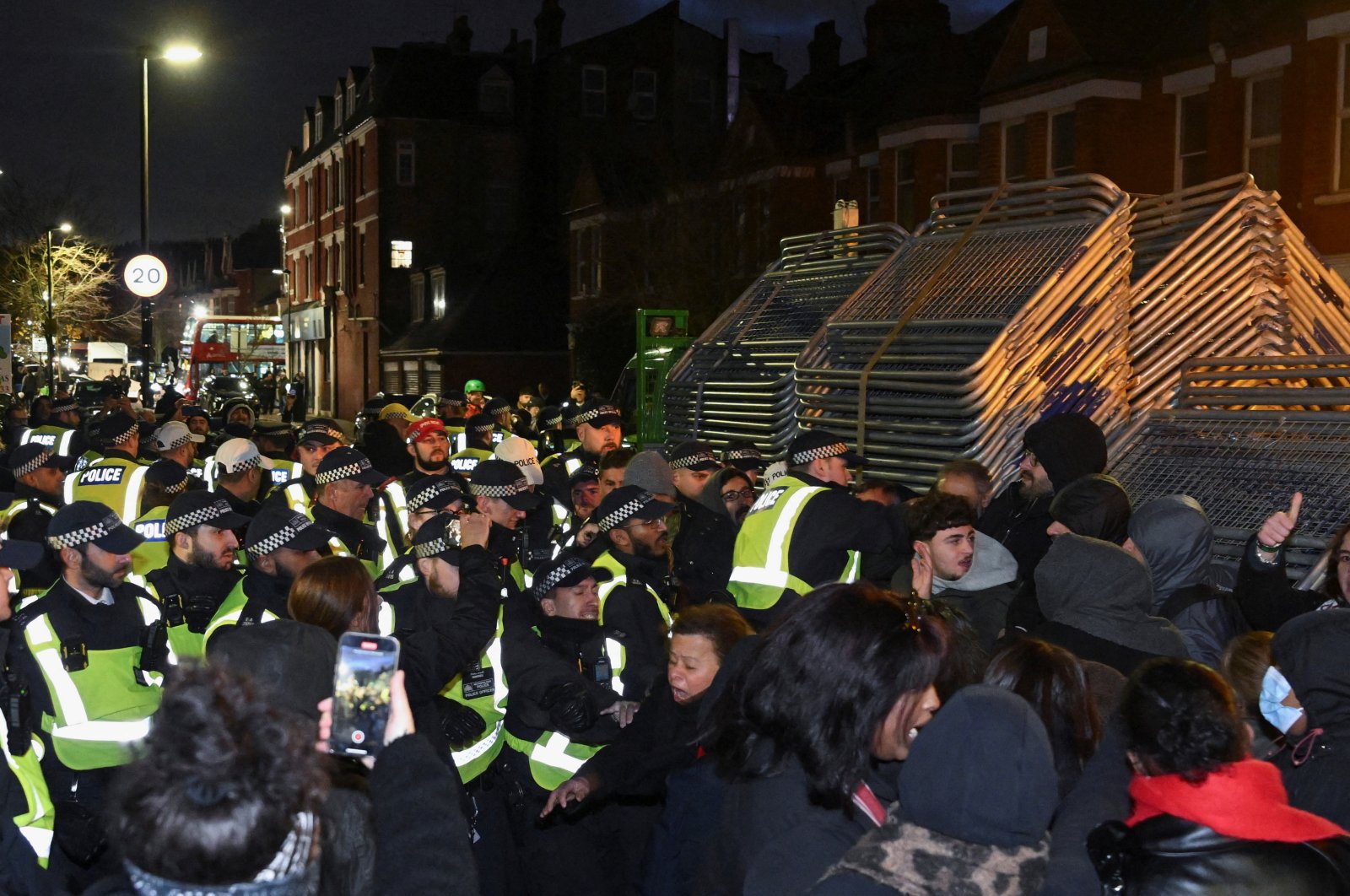 PKK terrorist sympathizers clash with police officers near a Kurdish community center after a counterterrorism investigation into activity linked to the PKK terrorist group, London, Britain, Nov. 27, 2024. (Reuters Photo)