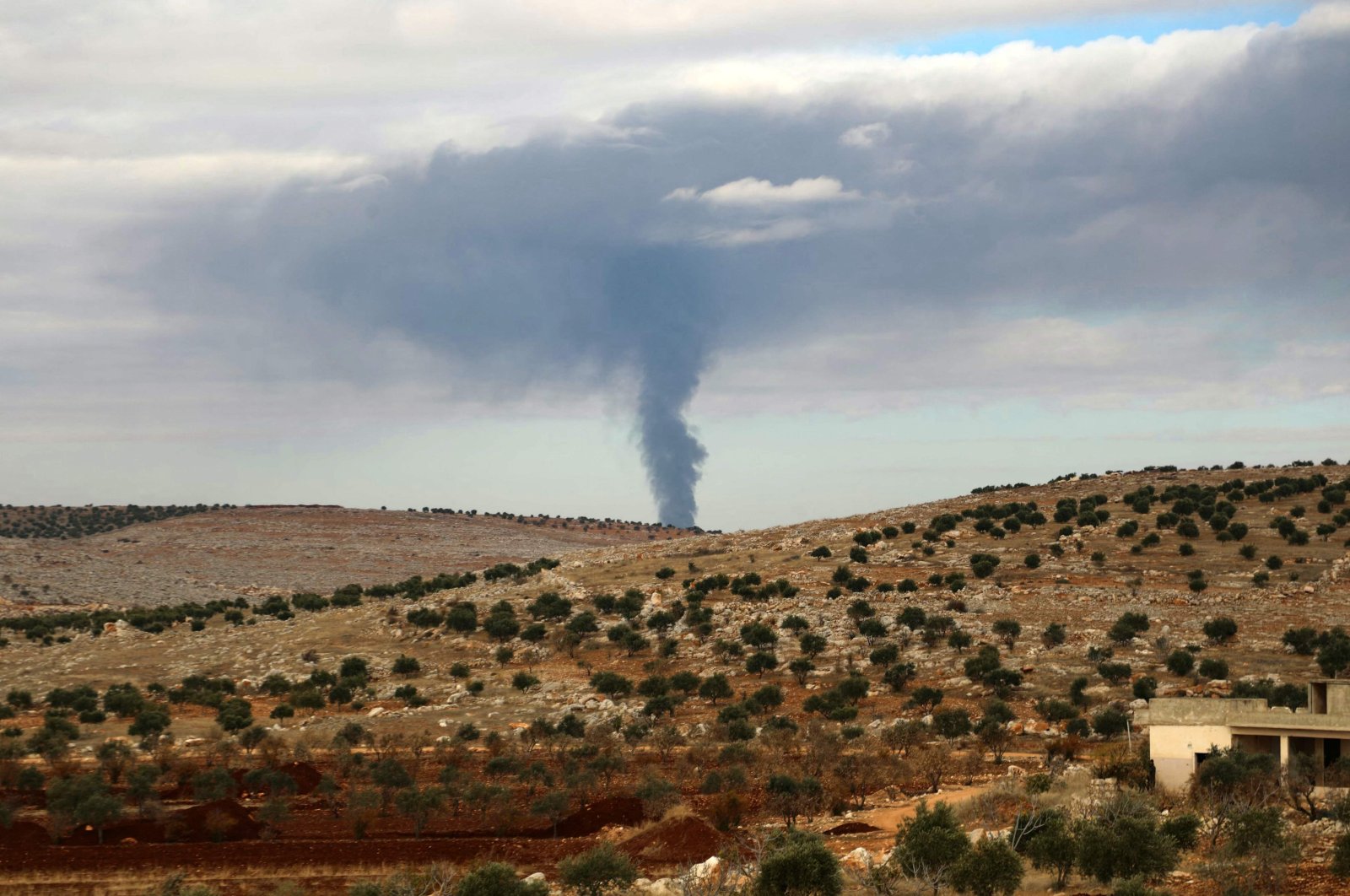 Smoke rises during clashes between members of Hayat Tahrir al-Sham and Assad regime forces, near Atarib, Syria, Nov. 27, 2024. (AFP Photo)