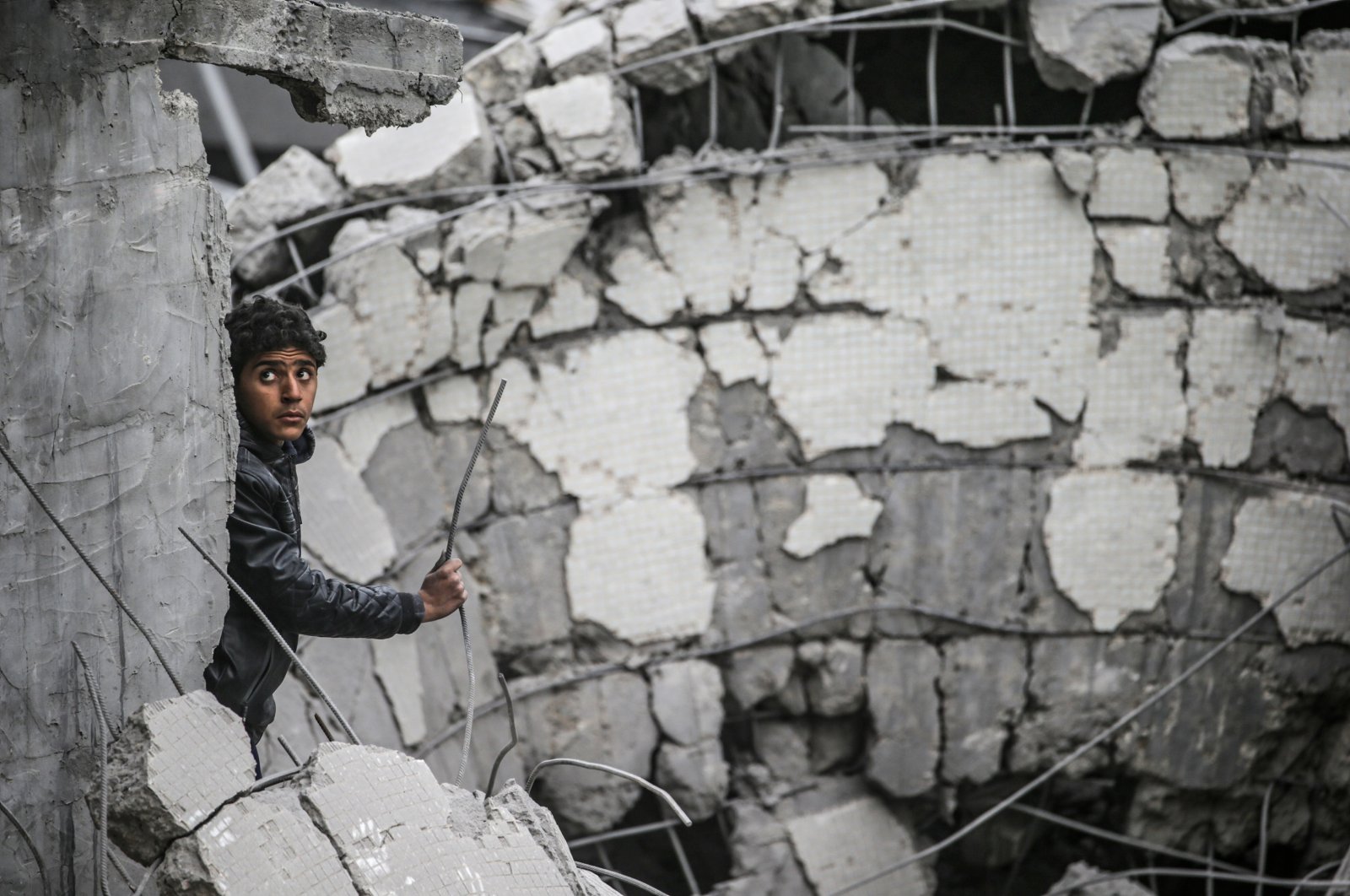 A Palestinian youth inspects a house destroyed by an overnight Israeli airstrike in central Gaza, Palestine, Nov. 27, 2024. (EPA Photo)