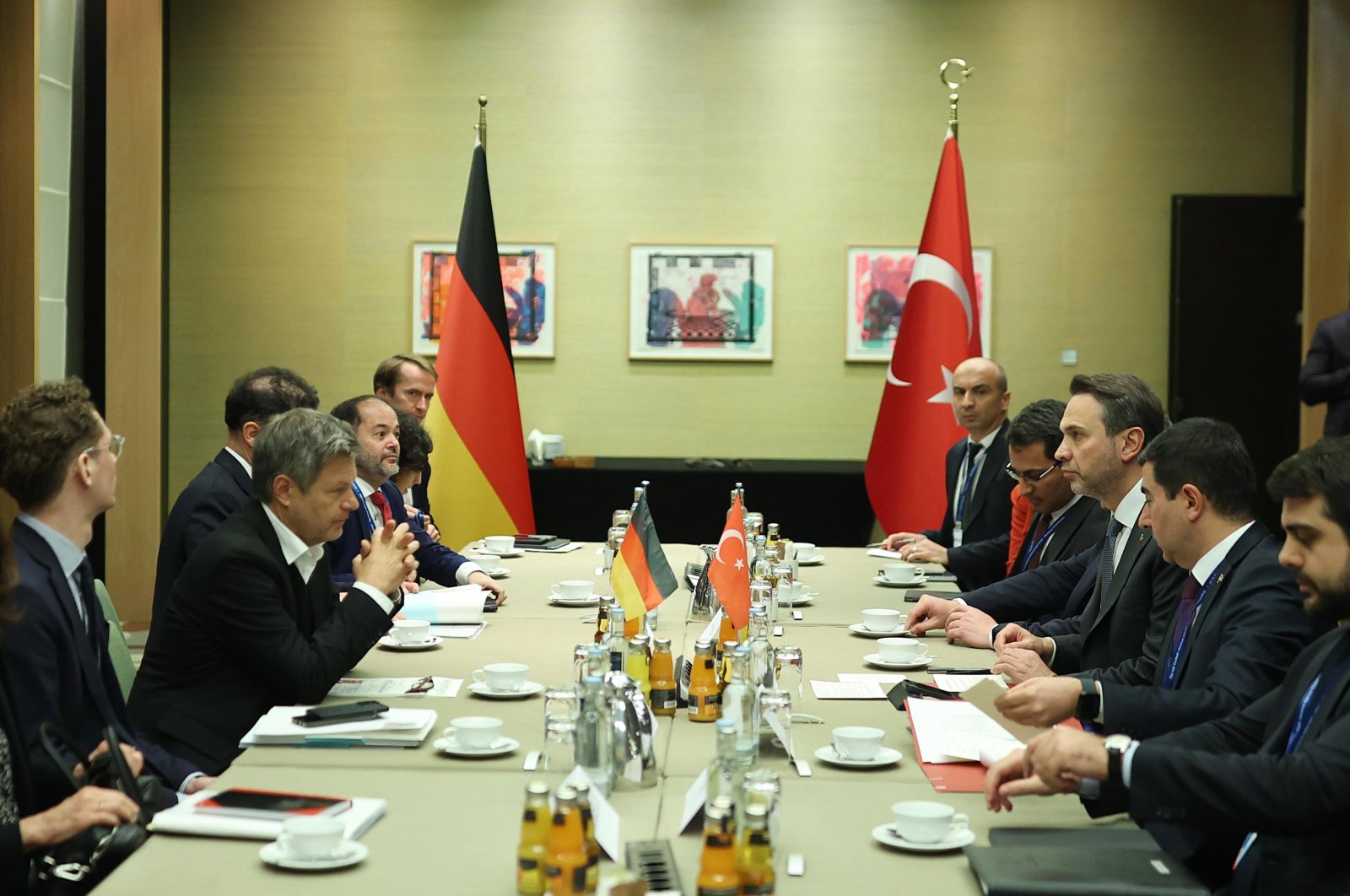 Energy and Natural Resources Minister Alparslan Bayraktar (R-C) and German Vice-Chancellor and Economy and Climate Minister Robert Habeck (L-C) converse during a meeting at the German-Turkish Energy Forum, Berlin, Germany, Nov. 27, 2024. (DHA Photo)