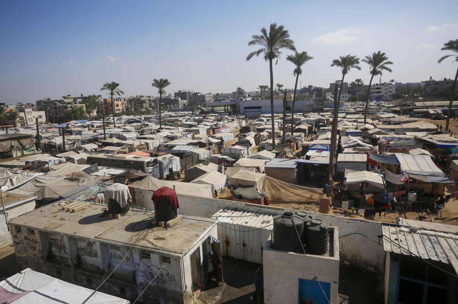 Palestinians who took refuge in a school belonging to the United Nations Relief and Works Agency for Palestine Refugees in the Near East (UNRWA) west of Deir al-Belah continue their daily lives in difficult conditions, central Gaza Strip, Palestine, Oct. 31, 2024. (AA Photo)