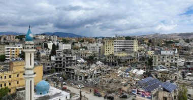 This aerial view taken a day after a cease-fire between Israel and Hezbollah took hold shows people inspecting the damage, Nabatieh, Lebanon, Nov. 28, 2024. (AFP Photo)