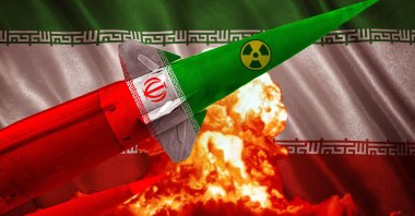 A nuclear missile with Iran&#039;s flag and symbol flies against a backdrop of an explosion, representing the nuclear threat, geopolitical tensions and Iran&#039;s missile program. (Shutterstock Photo)