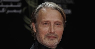 Mads Mikkelsen poses for photographers before the opening ceremony of the Marrakech International Film Festival in Marrakech, Morroco, Nov. 24, 2023. (Photo by Vianney Le Caer/Invision/AP)