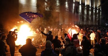 Georgian opposition supporters protest in front of the Parliament building, Tbilisi, Georgia, Nov. 29, 2024. (EPA Photo)