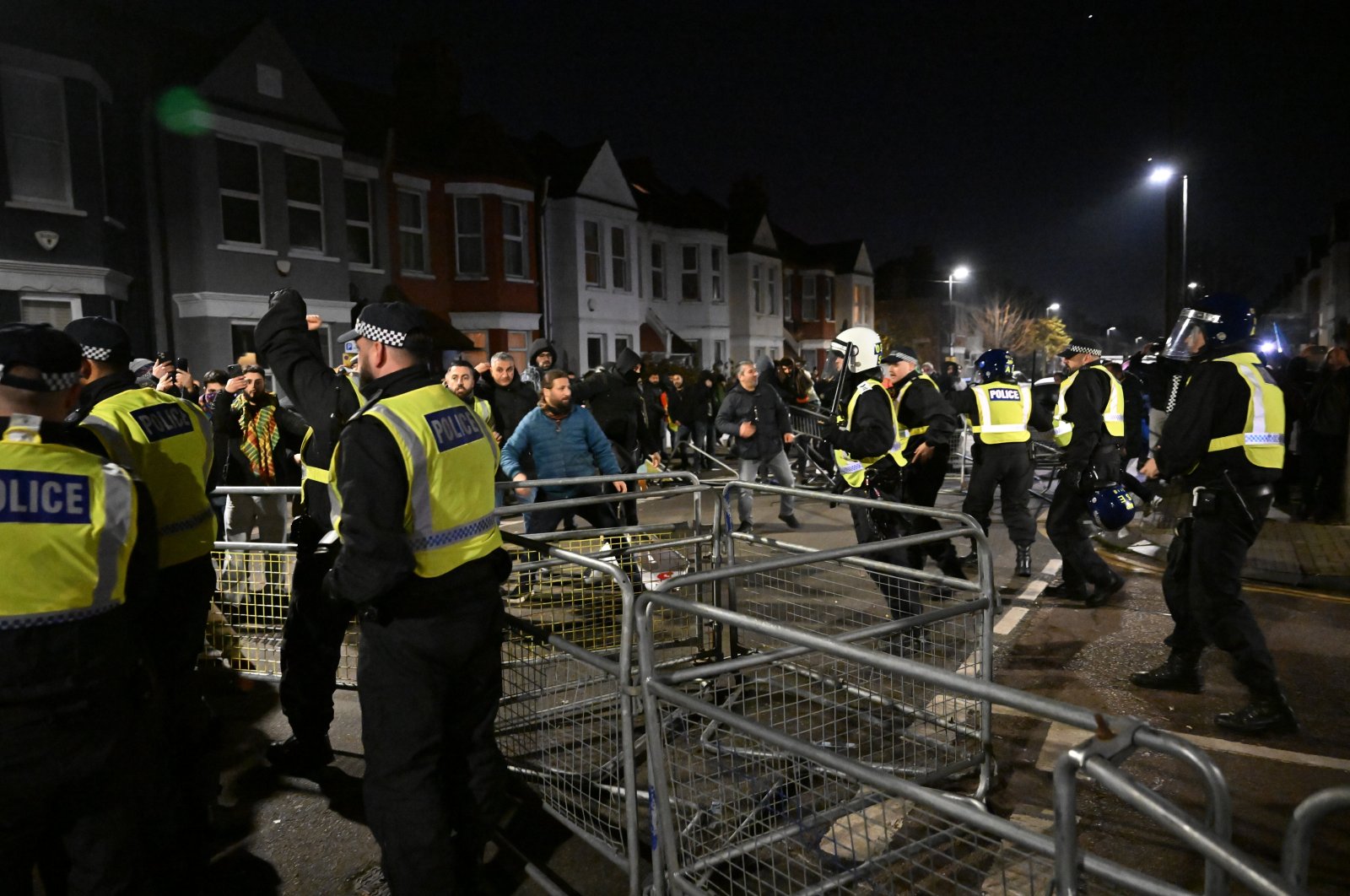 PKK sympathizers clash with police officers after a counterterrorism investigation into activity linked to the PKK terrorist group, London, Britain, Nov. 28, 2024. (AA Photo)