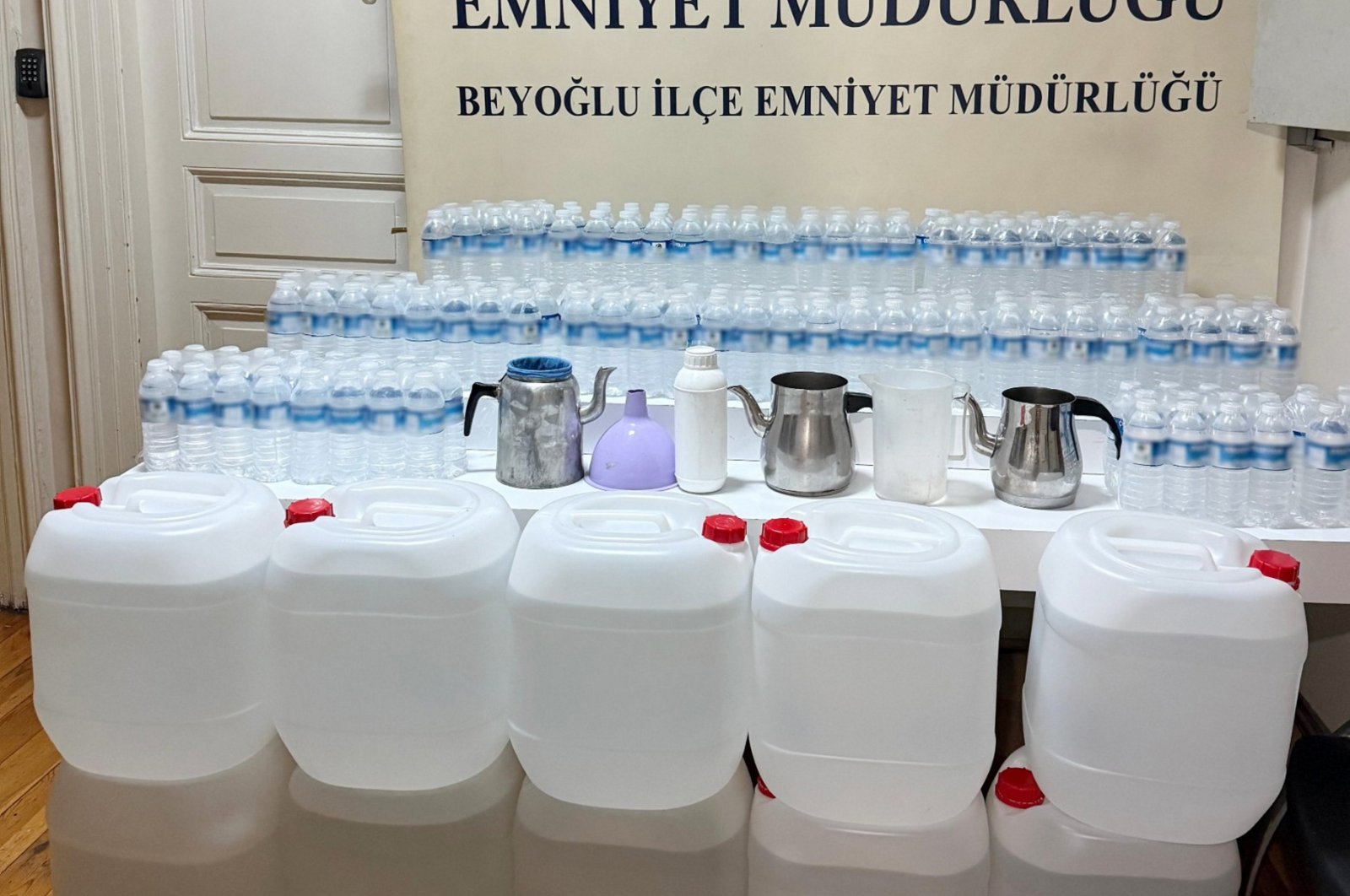 In a photo provided by the Istanbul Police Department, bootleg alcohol confiscated during operations is displayed at a police station in Istanbul, Türkiye, Nov. 28, 2024. (AA Photo)