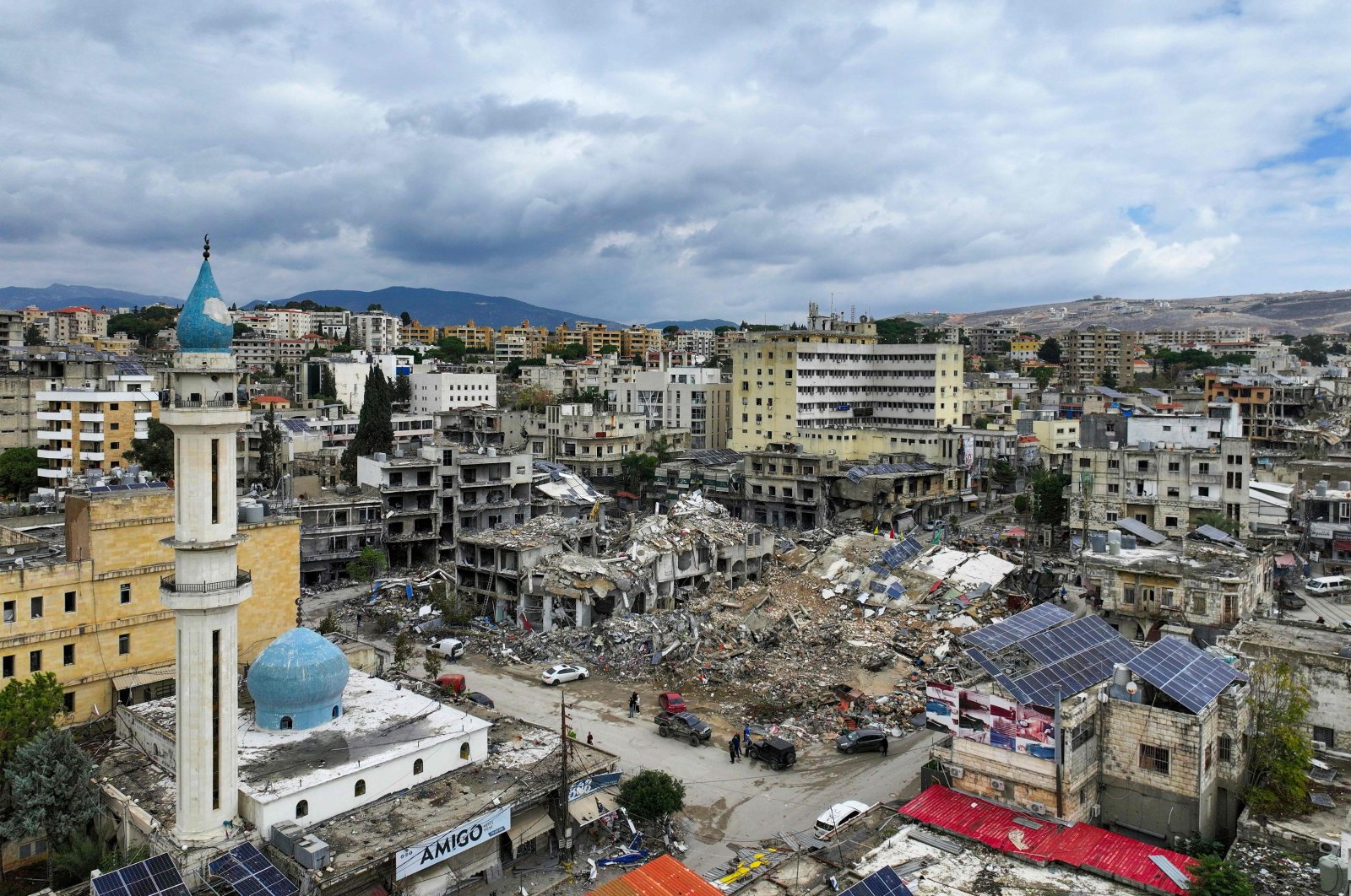 This aerial view taken a day after a cease-fire between Israel and Hezbollah took hold shows people inspecting the damage, Nabatieh, Lebanon, Nov. 28, 2024. (AFP Photo)