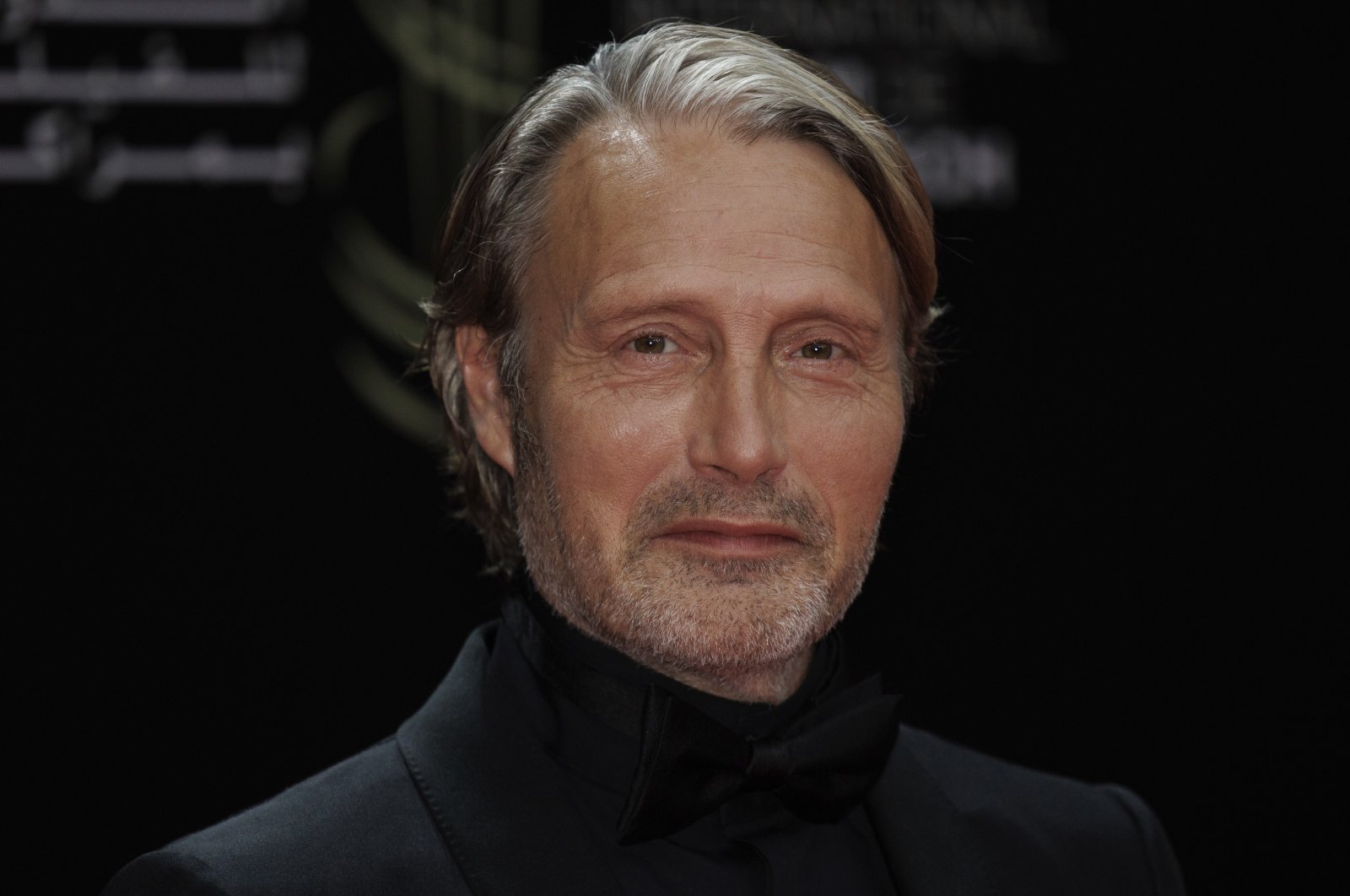 Mads Mikkelsen poses for photographers before the opening ceremony of the Marrakech International Film Festival in Marrakech, Morroco, Nov. 24, 2023. (Photo by Vianney Le Caer/Invision/AP)