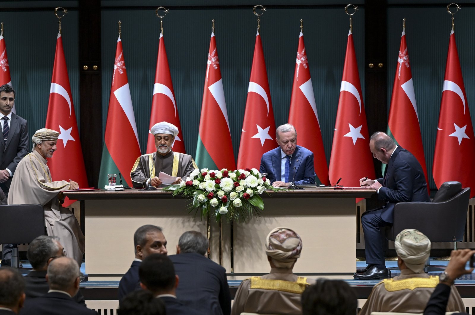 President Recep Tayyip Erdoğan (C-R) and Oman&#039;s Sultan Haitham bin Tariq Al Said (C-L) oversee a signing ceremony between OYAK and the Oman Investment Authority, Ankara, Türkiye, Nov. 28, 2024. (AA Photo)