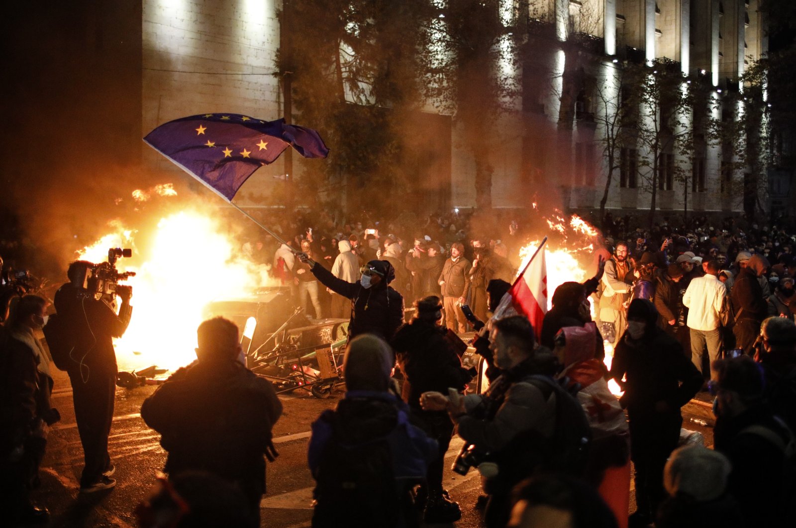 Georgian opposition supporters protest in front of the Parliament building, Tbilisi, Georgia, Nov. 29, 2024. (EPA Photo)