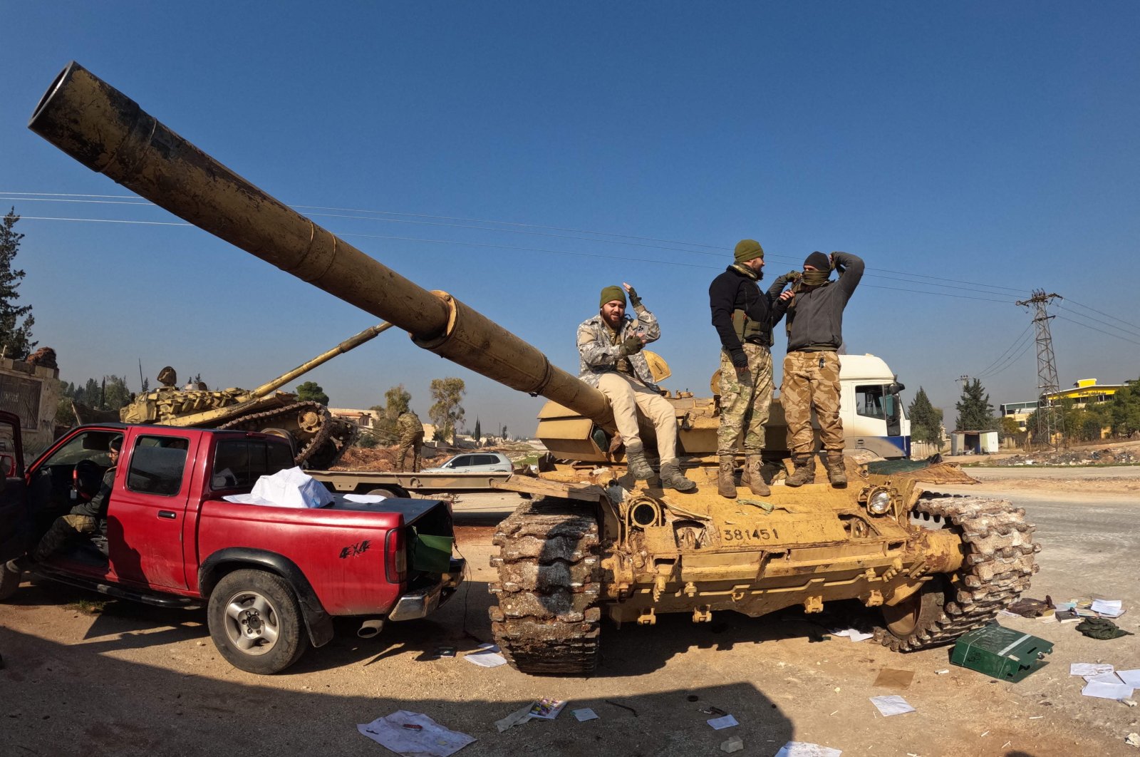 Fighters seize a Syrian regime tank on the international M5 highway in the area Zarbah, which was taken over by anti-regime factions, Aleppo, Syria, Nov. 29, 2024. (AFP Photo)