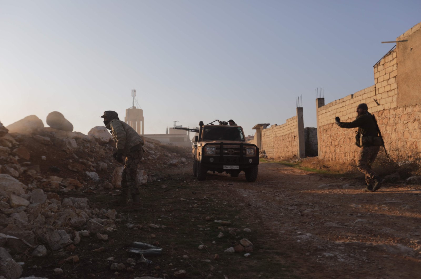 Opposition fighters fire toward Syrian Army troops in the Rashidin district on the outskirts of Aleppo, Nov. 29, 2024. (AFP Photo)