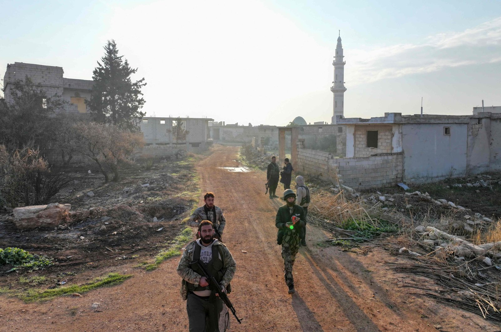 Fighters enter the village of Talhiyah, located east of the northwestern Syrian city of Idlib near the Taftanaz military airport, Nov. 29, 2024. (AFP Photo)